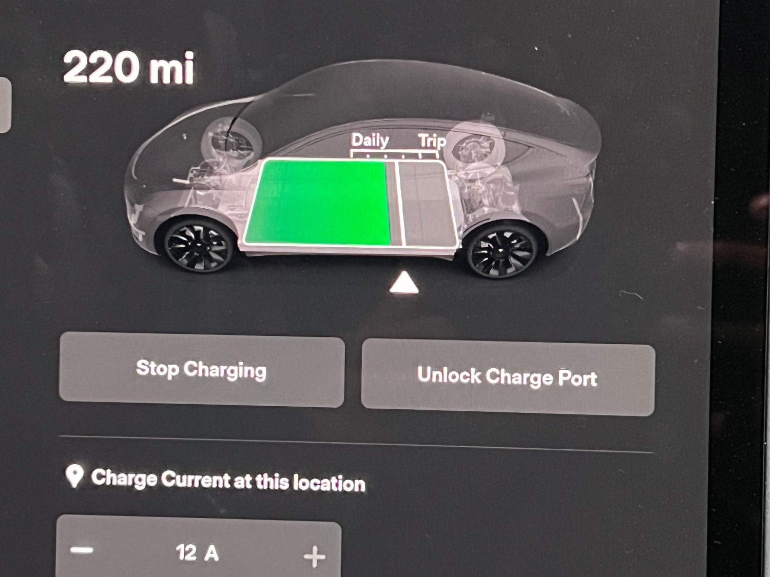 In-car display button to Unlock charge port