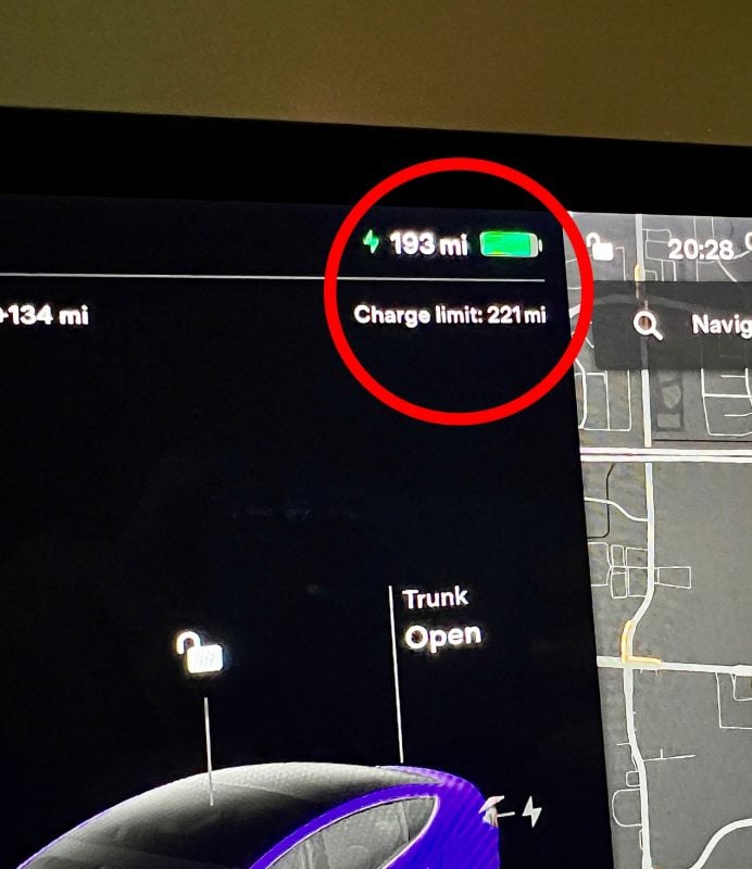 The charging limit is set to 100%, which reads as 221 miles on this Tesla with a degraded battery.