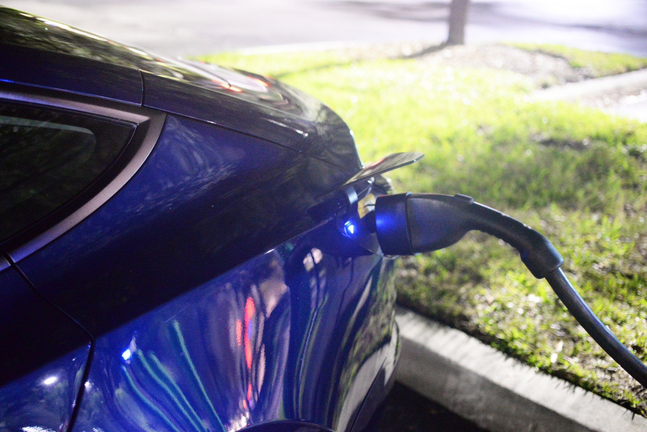 Tesla Model 3 using a CCS adapter at an EVgo station