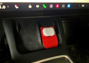 AirPods Pros charging in a Tesla with a 3d printed adapter